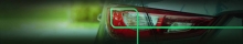 A imagem mostra a lanterna traseira de um veículo como referência a um veículo usado